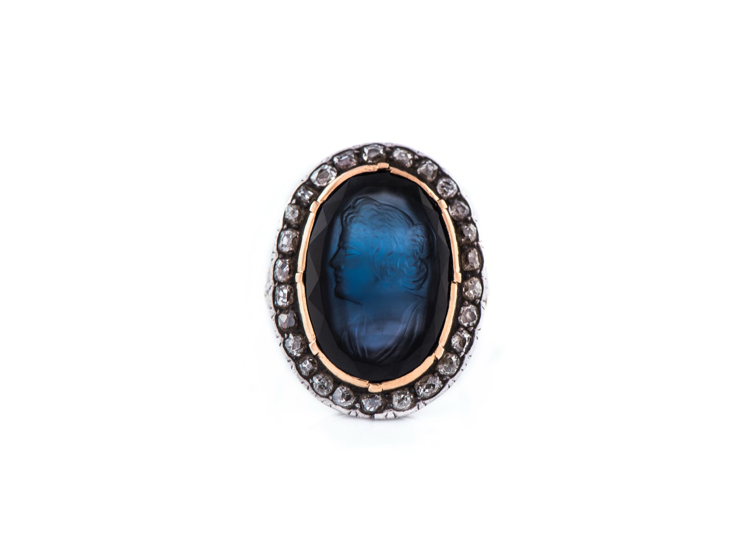 Antique ring with an oval blue intaglio and a diamond halo
