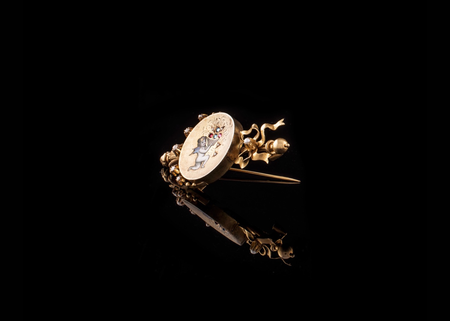 Antique gold cherub brooch